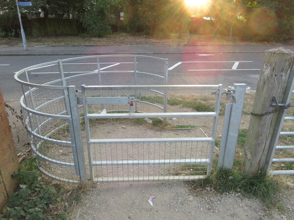 The photo for Locked gate at the end of Shared used path Hayling Drive.